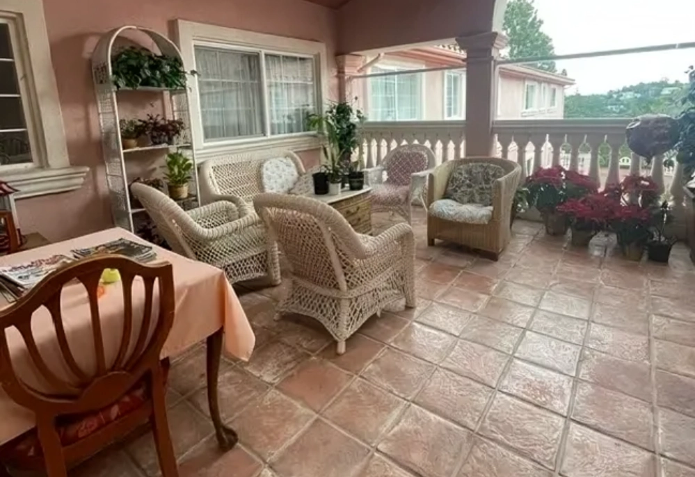 A patio with chairs and tables in it